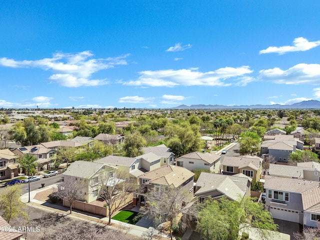 birds eye view of property with a mountain view and a residential view