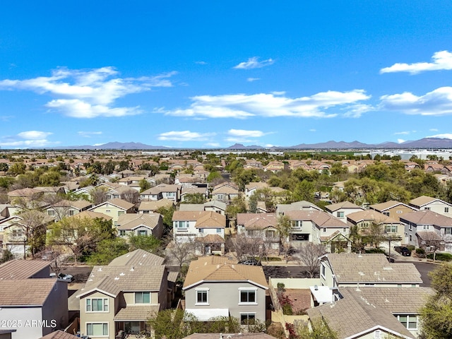 birds eye view of property with a residential view and a mountain view