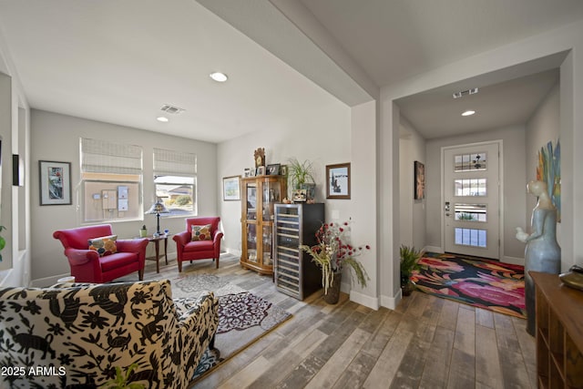 interior space with recessed lighting, visible vents, baseboards, and wood finished floors