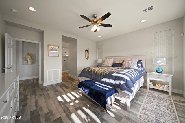 bedroom with dark wood-style floors, baseboards, and visible vents