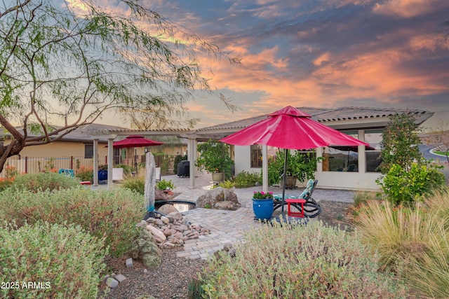 rear view of house with a patio area, fence, a pergola, and stucco siding