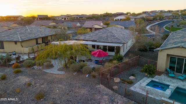 aerial view at dusk with a residential view