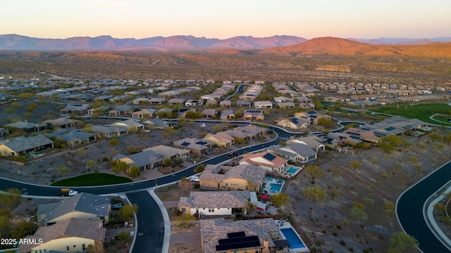 aerial view at dusk with a residential view and a mountain view