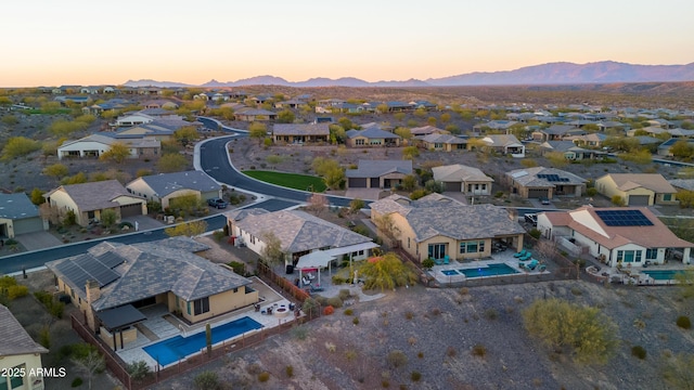 drone / aerial view with a residential view and a mountain view