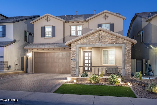 view of front of property with a garage