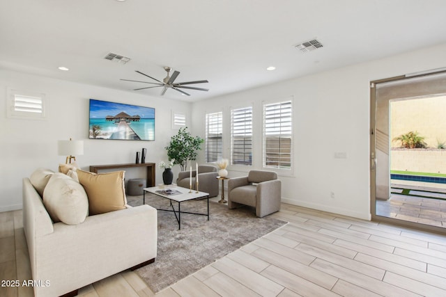 living room with ceiling fan