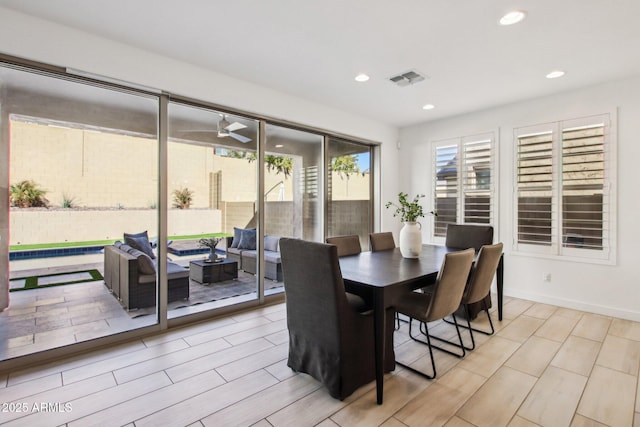 dining space featuring ceiling fan