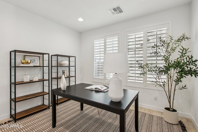 office space with hardwood / wood-style flooring