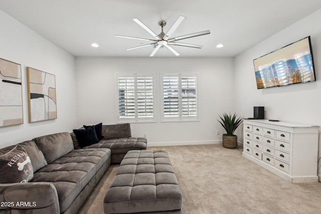 living room featuring light colored carpet and ceiling fan