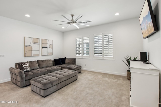 carpeted living room featuring ceiling fan