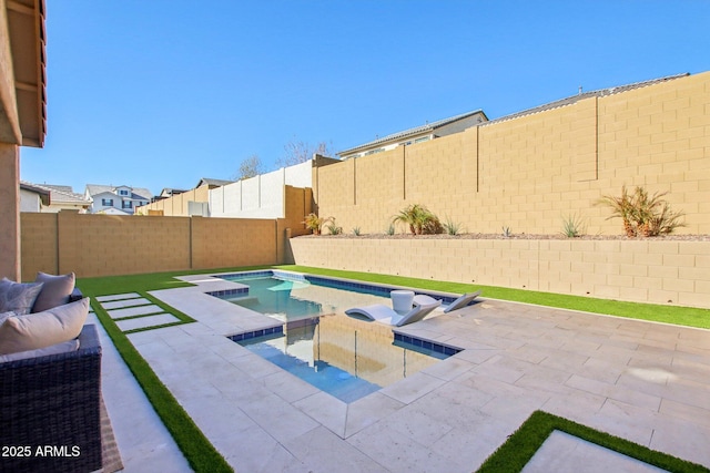 view of pool featuring a patio area and an in ground hot tub