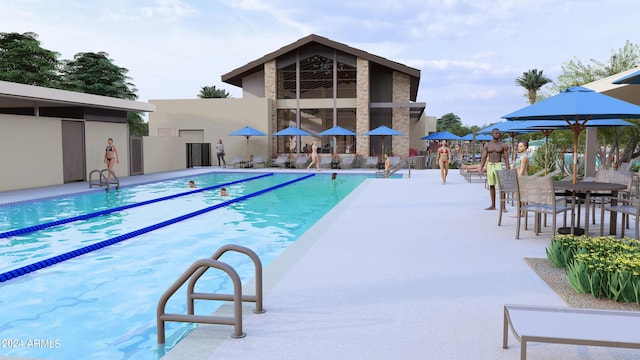 community pool with a patio area and fence