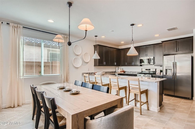 dining room with visible vents and recessed lighting