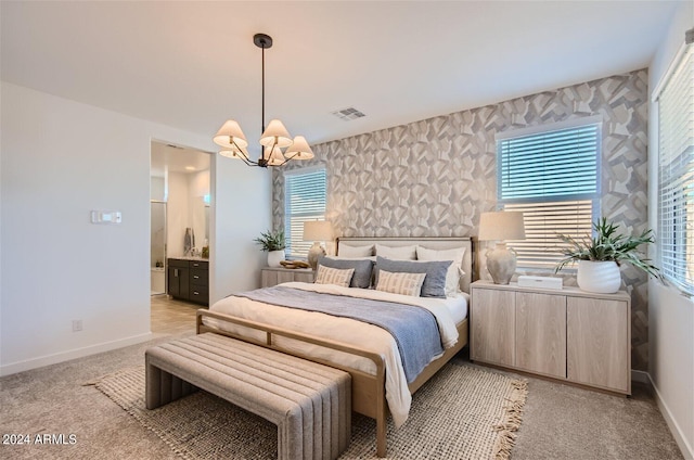 bedroom featuring visible vents, baseboards, an inviting chandelier, and wallpapered walls