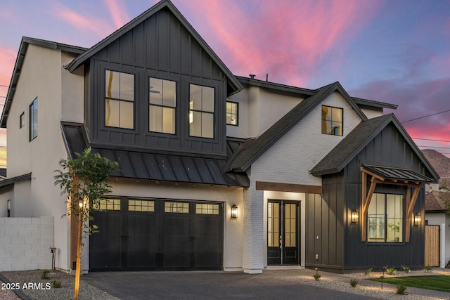 modern farmhouse featuring a garage