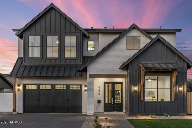 modern farmhouse style home with a garage