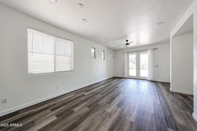 15365 W Valentine St, Surprise, AZ 85379 - spare room with dark wood-style floors, french doors, baseboards, and ceiling fan