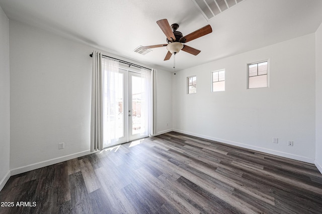 15365 W Valentine St, Surprise, AZ 85379 - spare room featuring dark wood-type flooring, baseboards, ceiling fan, and french doors
