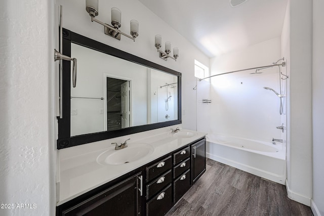 15365 W Valentine St, Surprise, AZ 85379 - bathroom featuring  shower combination, wood finished floors, and double vanity