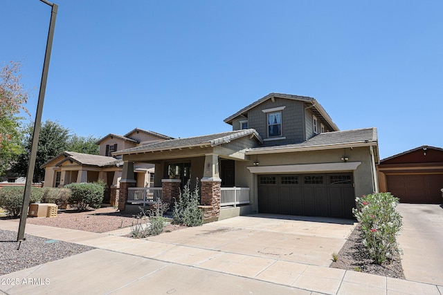 15365 W Valentine St, Surprise, AZ 85379 - craftsman-style house featuring covered porch, driveway, stucco siding, and a garage