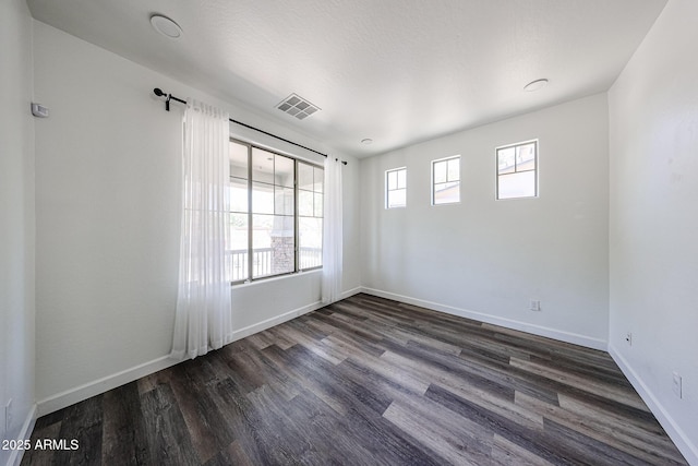 15365 W Valentine St, Surprise, AZ 85379 - unfurnished room with dark wood-style flooring and baseboards