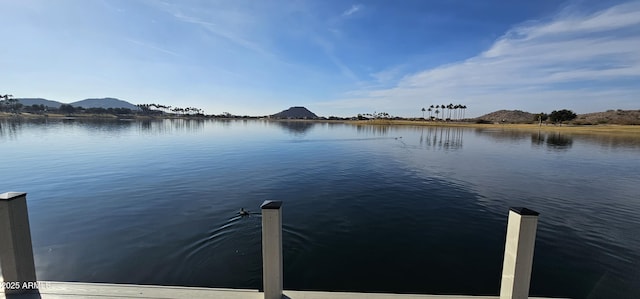 dock area with a water and mountain view