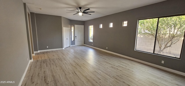 empty room featuring light hardwood / wood-style floors and ceiling fan