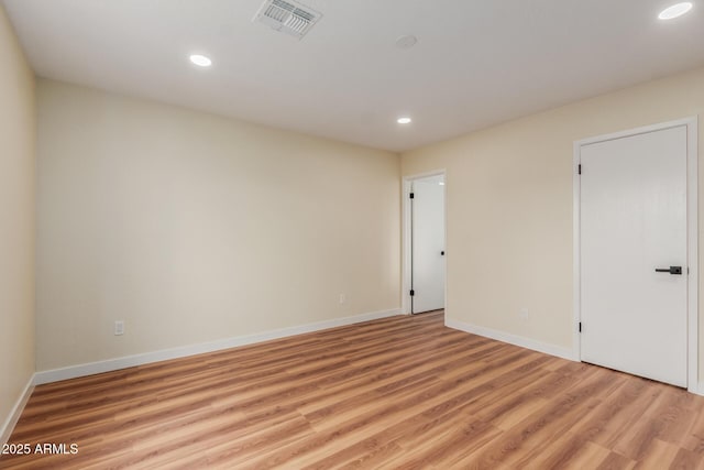 unfurnished room featuring visible vents, recessed lighting, baseboards, and light wood-style floors