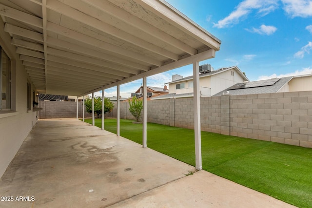 view of patio with cooling unit and a fenced backyard