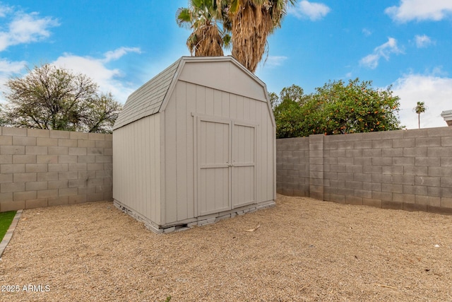 view of shed with a fenced backyard