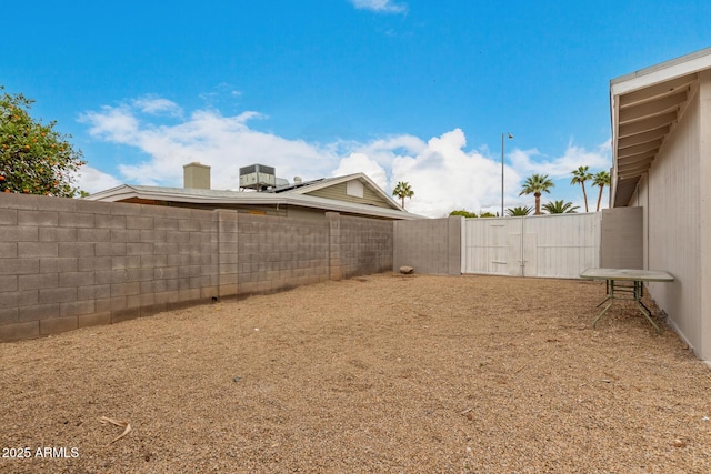 view of yard with a fenced backyard