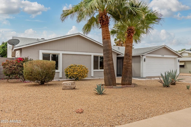 ranch-style house with stucco siding, concrete driveway, and an attached garage