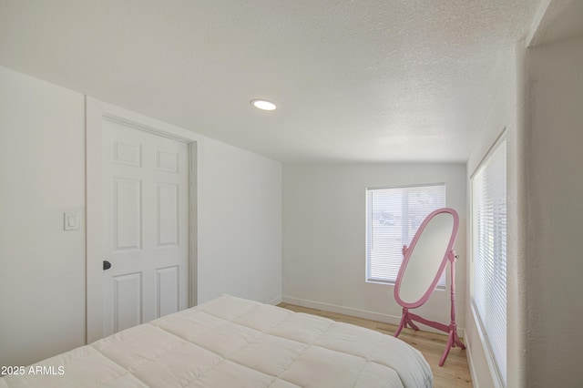 520 S Macdonald, Mesa, AZ 85210 - bedroom with light wood-style flooring, recessed lighting, baseboards, and a textured ceiling