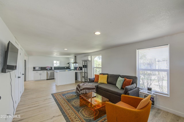 520 S Macdonald, Mesa, AZ 85210 - living area with light wood-style floors, a textured ceiling, recessed lighting, and baseboards