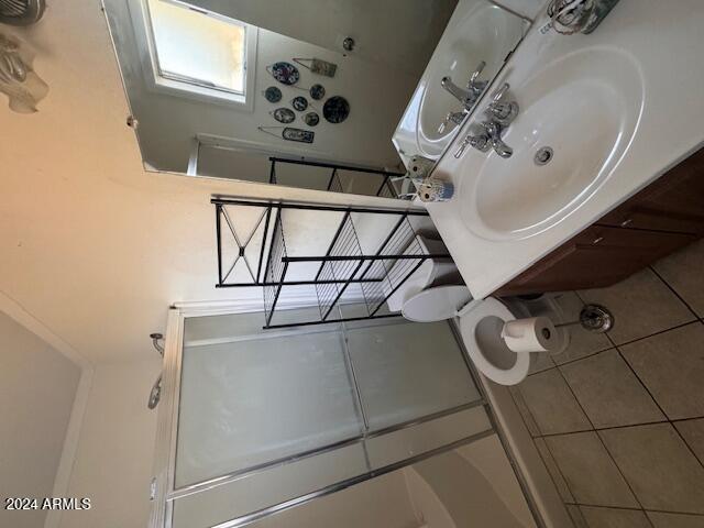 bathroom with tile patterned flooring and sink