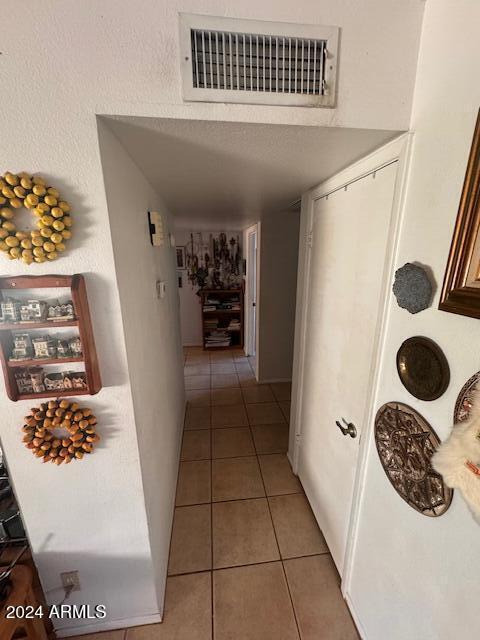 corridor with tile patterned flooring