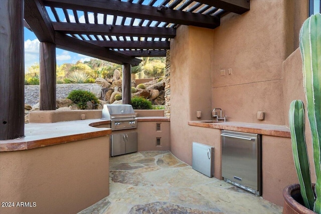 view of terrace with a pergola, sink, and exterior kitchen