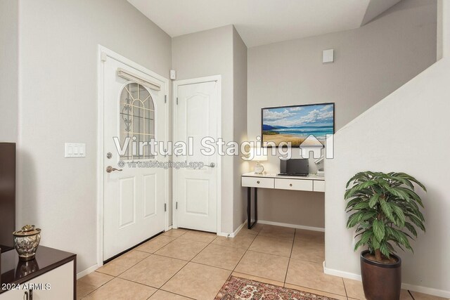 entrance foyer with light tile patterned flooring