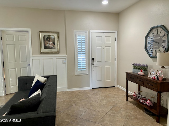 foyer entrance with light tile patterned floors