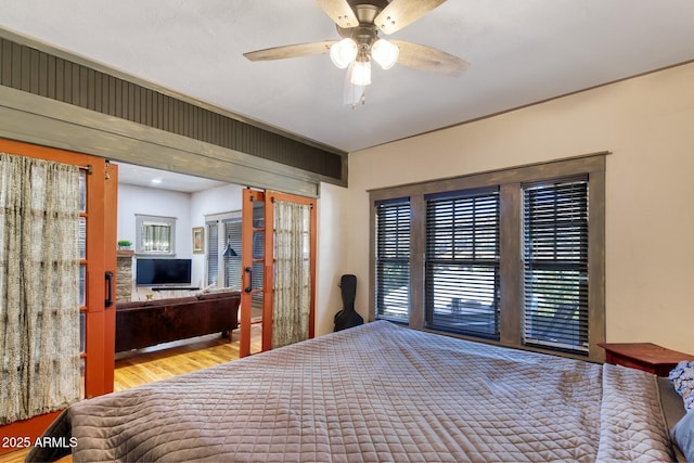 816 Tombstone Cyn Unit C, Bisbee, AZ 85603 - bedroom with wood finished floors and access to outside