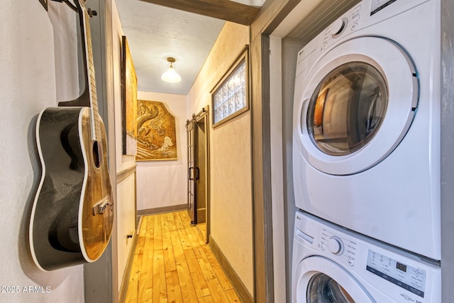 816 Tombstone Cyn Unit C, Bisbee, AZ 85603 - laundry area with estacked washer and dryer and light wood-type flooring
