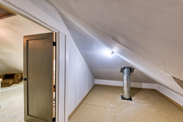 816 Tombstone Cyn Unit C, Bisbee, AZ 85603 - bonus room featuring lofted ceiling and baseboards