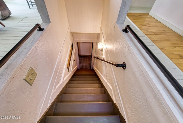 816 Tombstone Cyn Unit C, Bisbee, AZ 85603 - staircase featuring a textured wall and wood finished floors