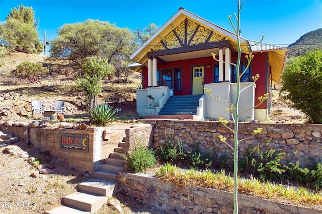 816 Tombstone Cyn Unit C, Bisbee, AZ 85603 - view of front of house featuring stairs and a porch