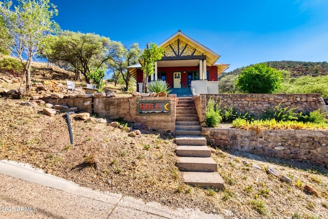 816 Tombstone Cyn Unit C, Bisbee, AZ 85603 - view of front of home featuring stairway and a porch