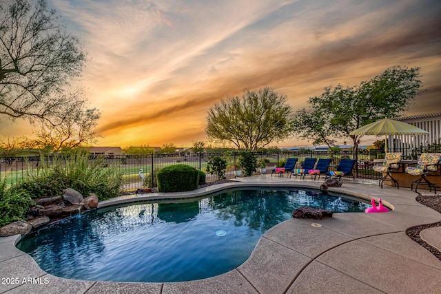 20558 N 263rd Dr, Buckeye, AZ 85396 - view of pool featuring a fenced in pool, fence, and a patio