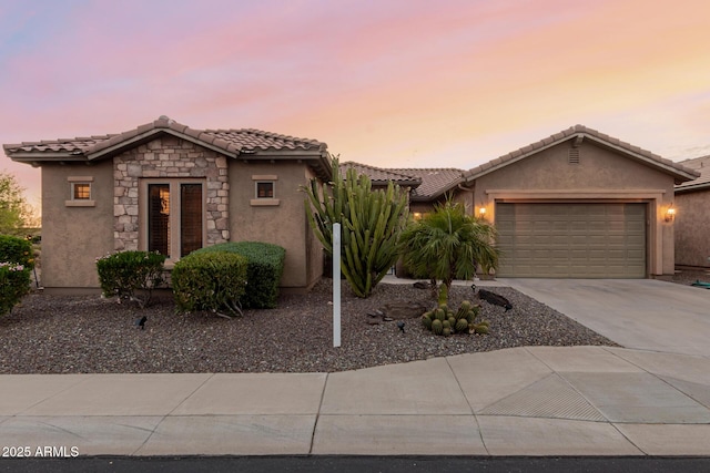 20558 N 263rd Dr, Buckeye, AZ 85396 - view of front of house featuring concrete driveway, stucco siding, a tile roof, and a garage