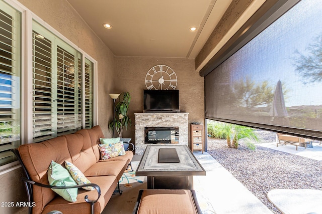 20558 N 263rd Dr, Buckeye, AZ 85396 - view of patio / terrace with an outdoor living space with a fireplace