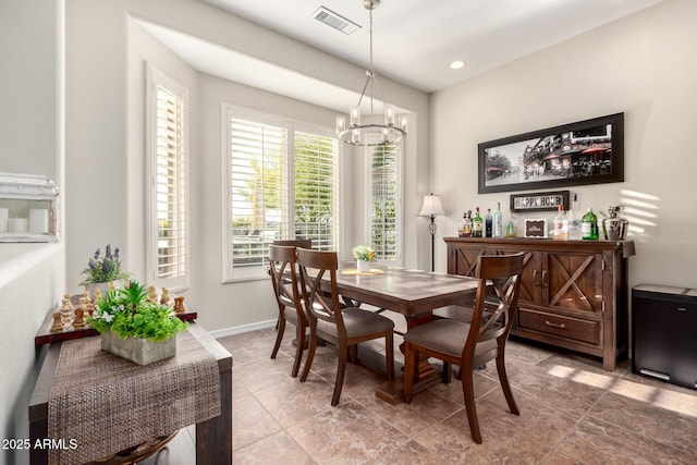tiled dining space with recessed lighting, baseboards, visible vents, and an inviting chandelier