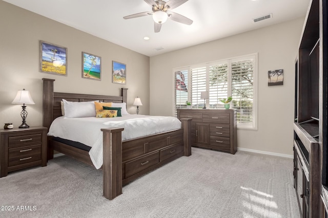 bedroom featuring baseboards, a ceiling fan, light colored carpet, and visible vents